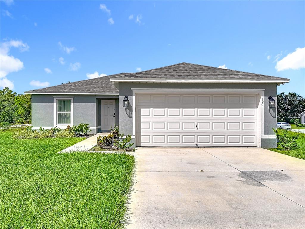 120 Bonito Way Kissimmee, FL 34759 - Photo 34 of 53 a front view of a house with garden