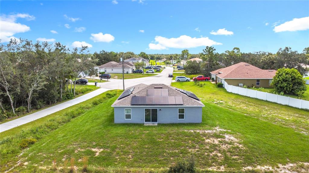 120 Bonito Way Kissimmee, FL 34759 - Photo 39 of 53 a view of a house with a big yard and large trees