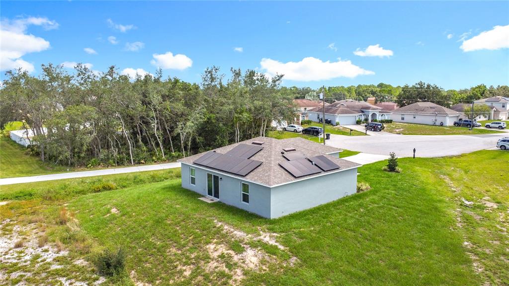 120 Bonito Way Kissimmee, FL 34759 - Photo 40 of 53 a view of a house with a big yard and large trees