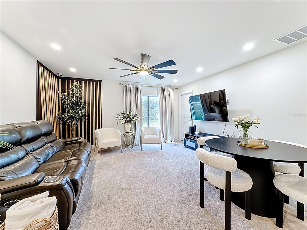 120 Bonito Way Kissimmee, FL 34759 - Photo 6 of 53 a living room with furniture and a flat screen tv