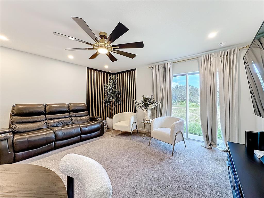 120 Bonito Way Kissimmee, FL 34759 - Photo 10 of 53 a living room with furniture and a large window
