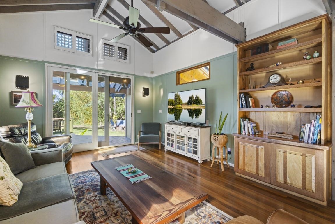 690 East Kuiaha Road Haiku, HI 96708 - Photo 11 of 30 a living room with furniture and a floor to ceiling window