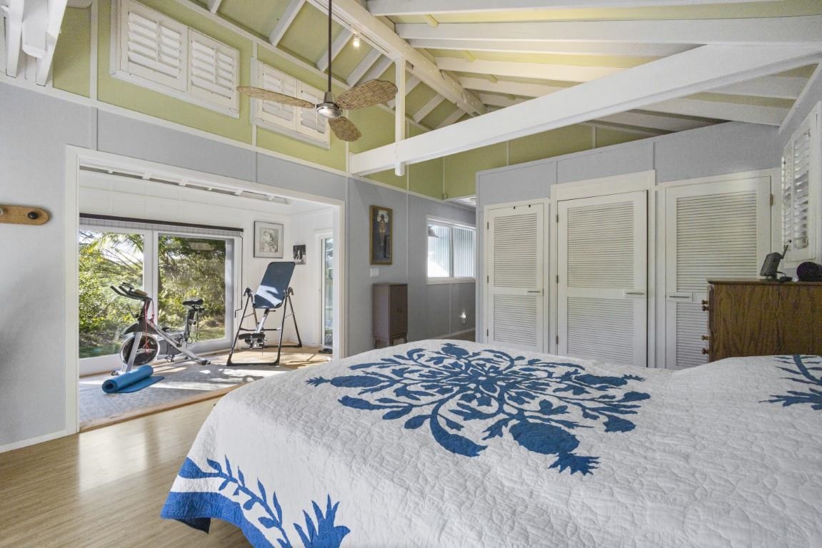 690 East Kuiaha Road Haiku, HI 96708 - Photo 16 of 30 a bedroom with a bed and a large mirror on the dresser