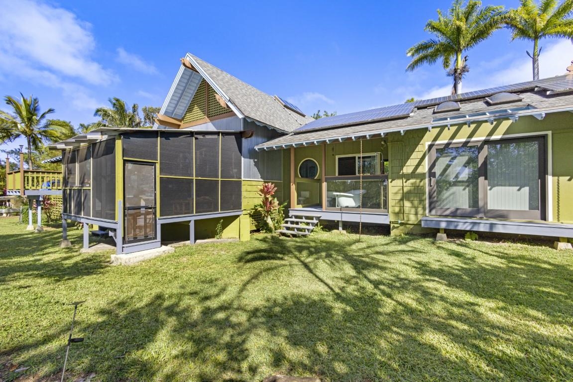 690 East Kuiaha Road Haiku, HI 96708 - Photo 22 of 30 a view of a house with backyard and porch