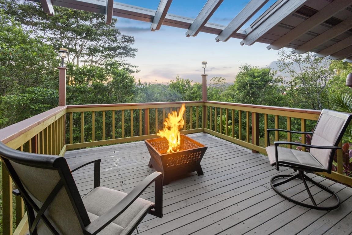 690 East Kuiaha Road Haiku, HI 96708 - Photo 27 of 30 a view of a chair on wooden deck