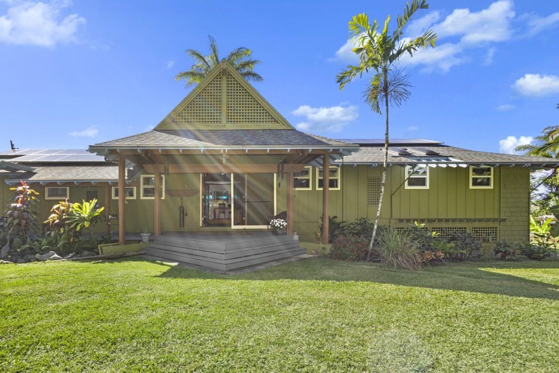 690 East Kuiaha Road Haiku, HI 96708 - Photo 3 of 30 a front view of a house with garden