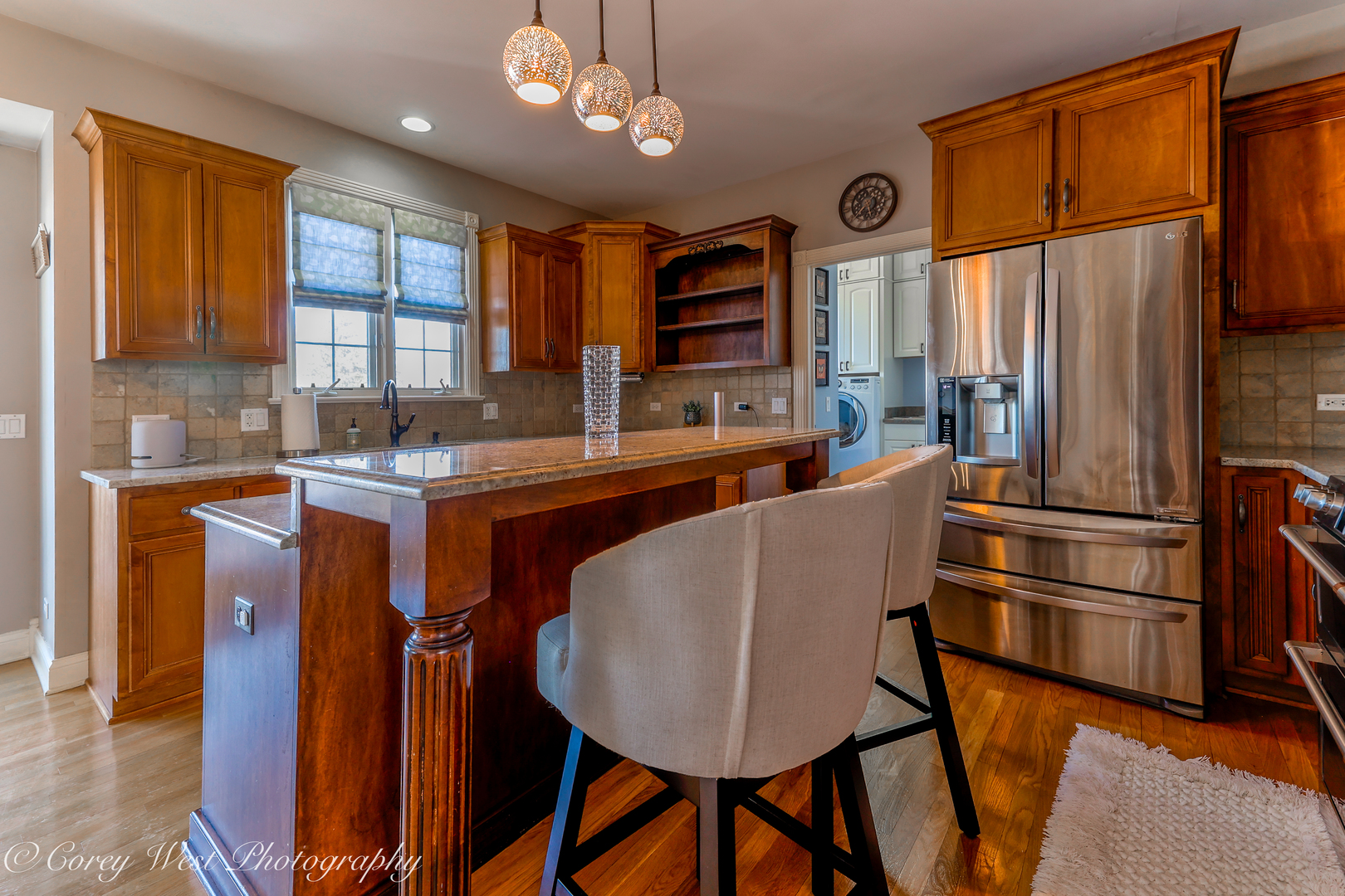 801 Citizen Avenue Elburn, IL 60119 - Photo 14 of 49 a kitchen with stainless steel appliances granite countertop a refrigerator a sink dishwasher a stove and a dining table with wooden cabinet