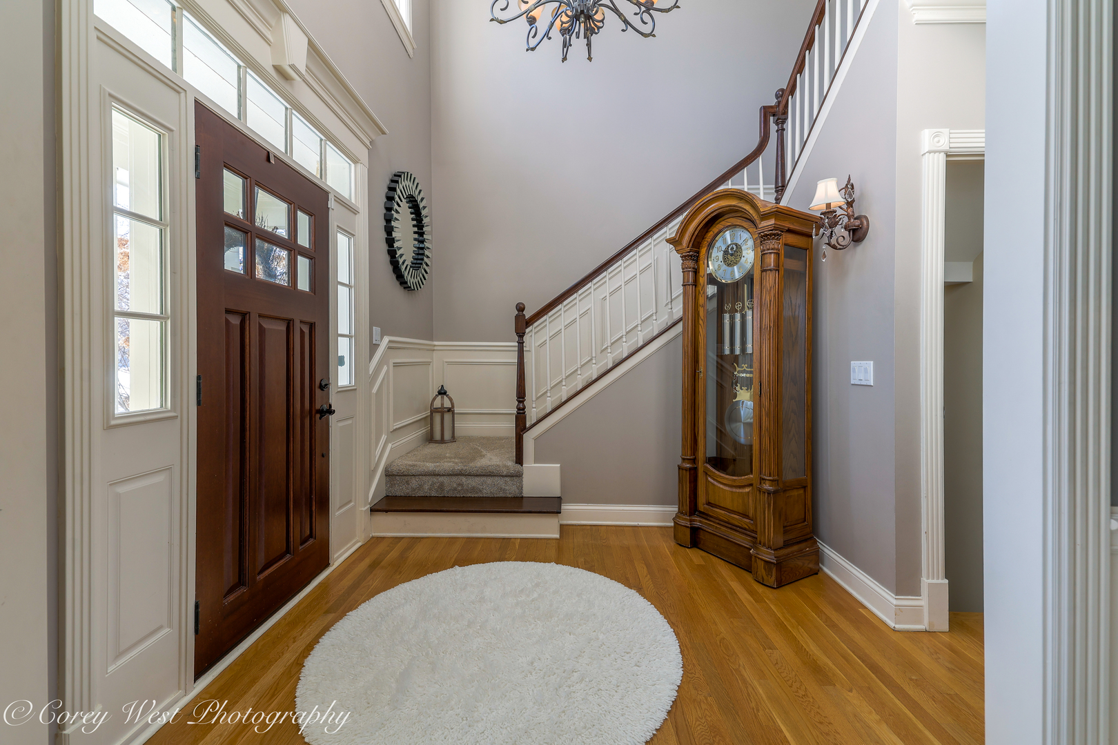 801 Citizen Avenue Elburn, IL 60119 - Photo 3 of 49 a view of staircase with lots of frames on wall and a large window