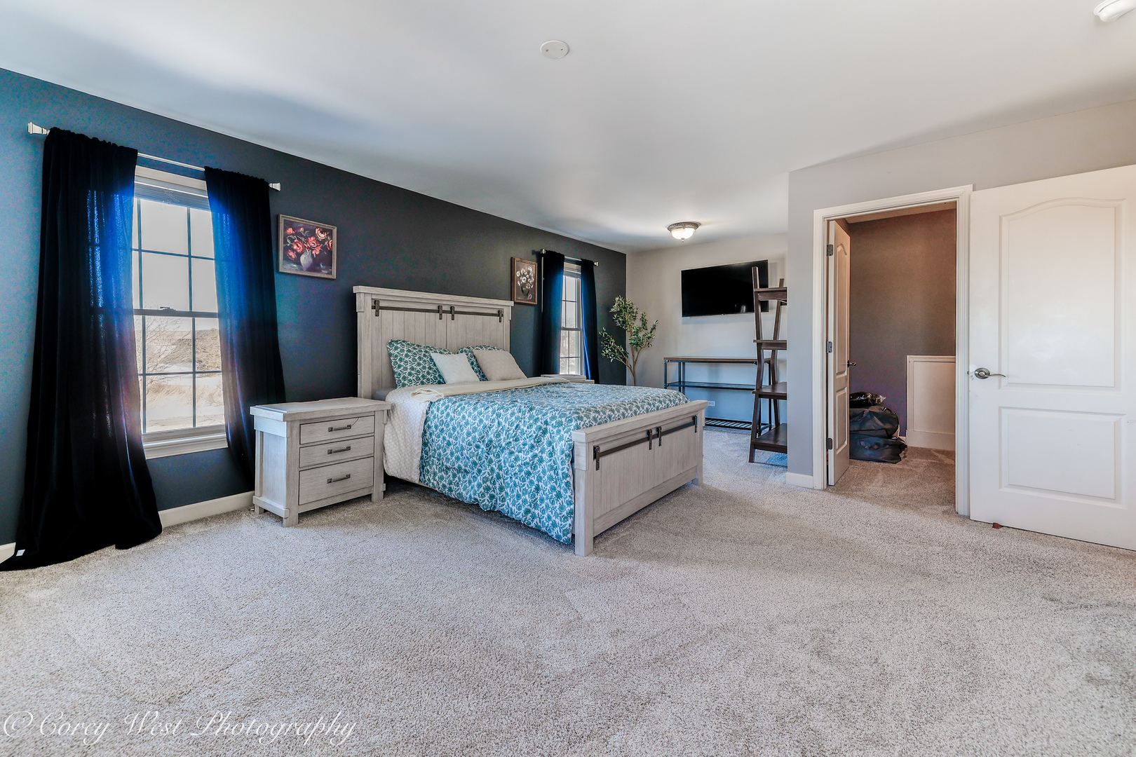 801 Citizen Avenue Elburn, IL 60119 - Photo 31 of 49 a spacious bedroom with a bed and a dresser