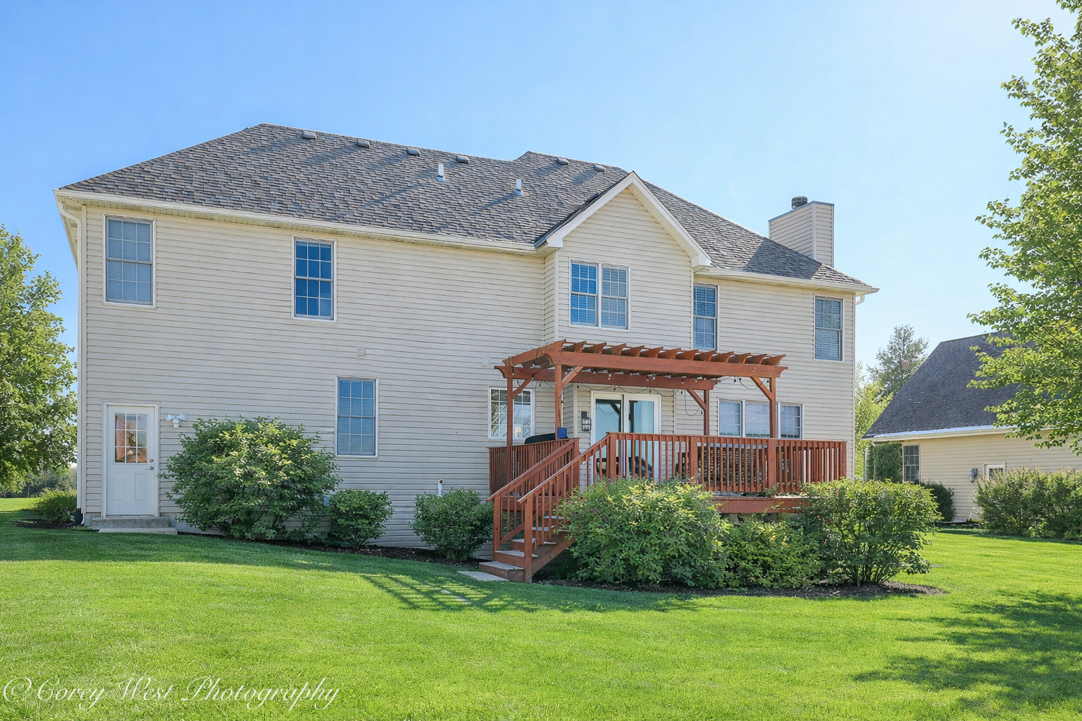 801 Citizen Avenue Elburn, IL 60119 - Photo 44 of 49 a front view of a house with a yard and potted plants