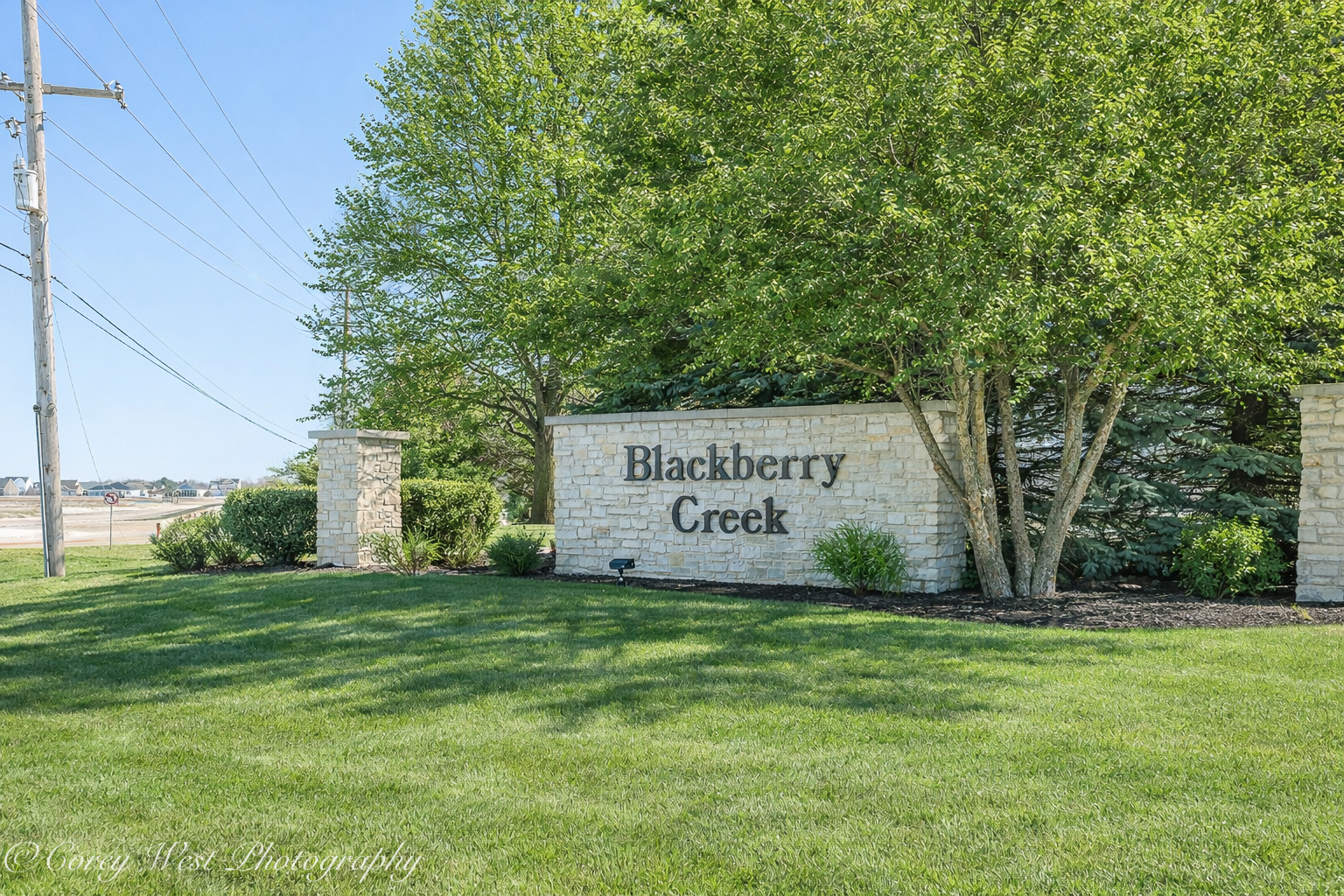 801 Citizen Avenue Elburn, IL 60119 - Photo 49 of 49 a sign of golf club on a wall under a tree