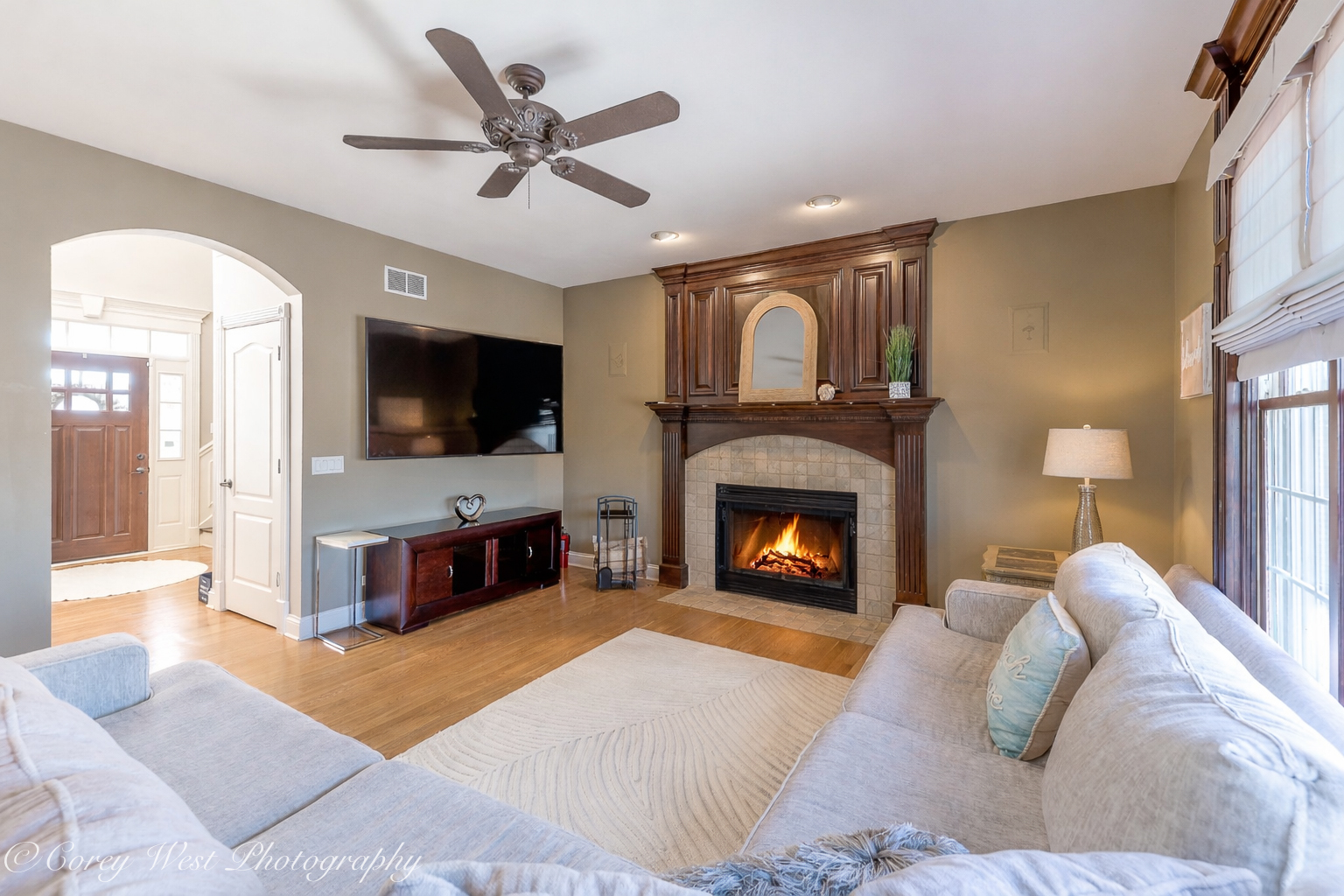 801 Citizen Avenue Elburn, IL 60119 - Photo 7 of 49 a living room with furniture a fireplace and a flat screen tv