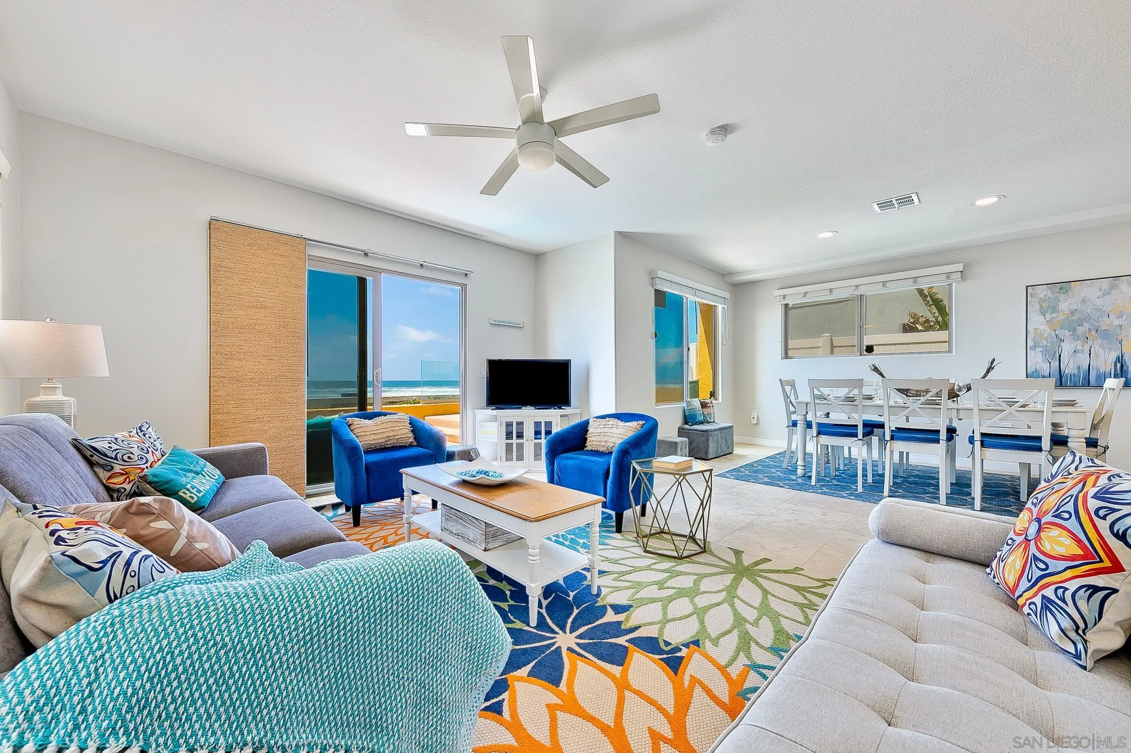 3537 Ocean Front Walk San Diego, CA 92109 - Photo 13 of 51 a living room with furniture kitchen view and a large window