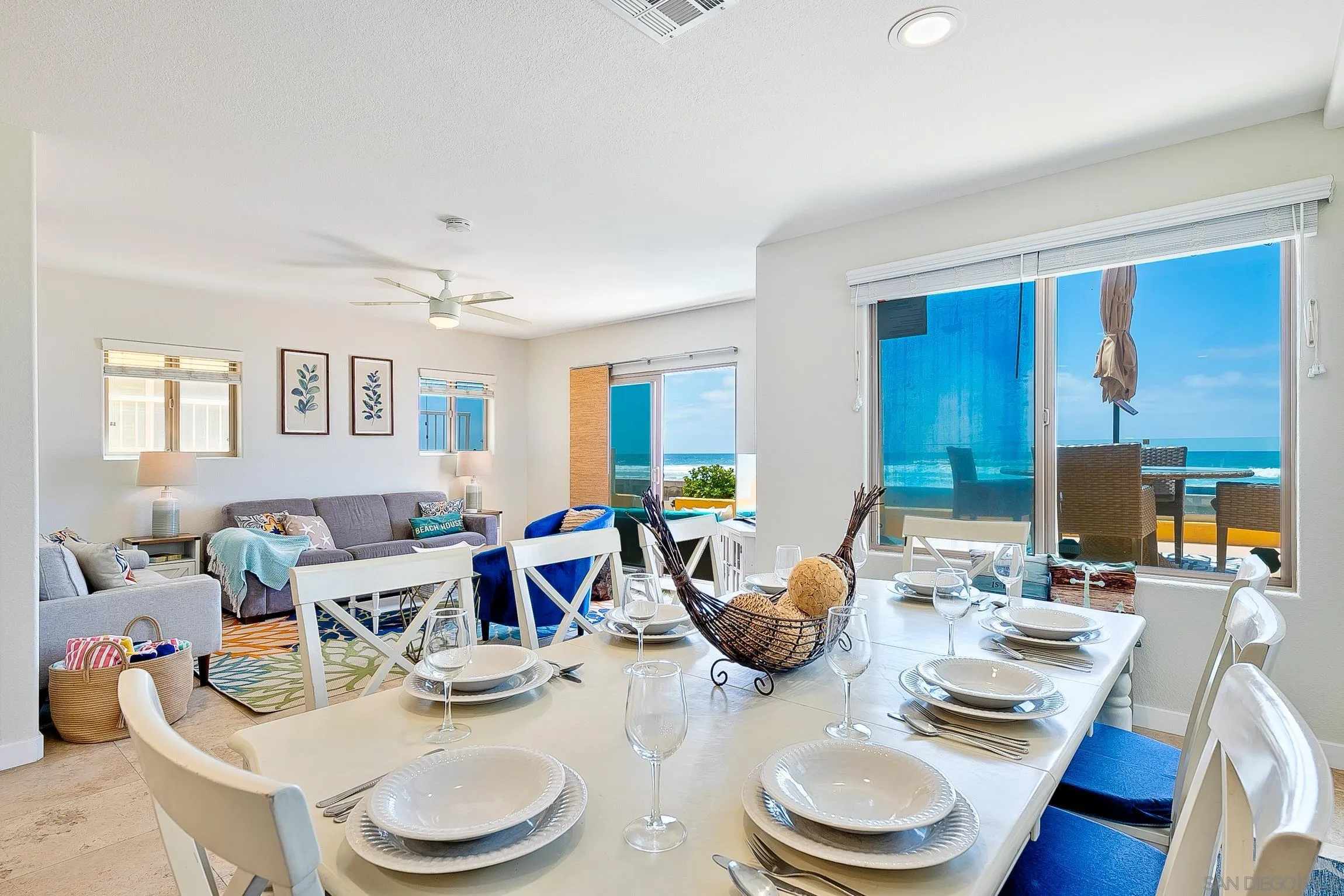 3537 Ocean Front Walk San Diego, CA 92109 - Photo 17 of 51 a dining room with furniture a wooden floor and a sink