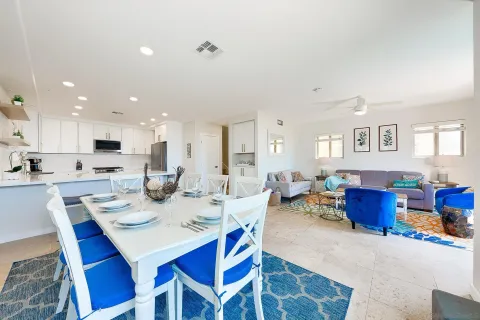 a kitchen with stainless steel appliances granite countertop a refrigerator sink and stove