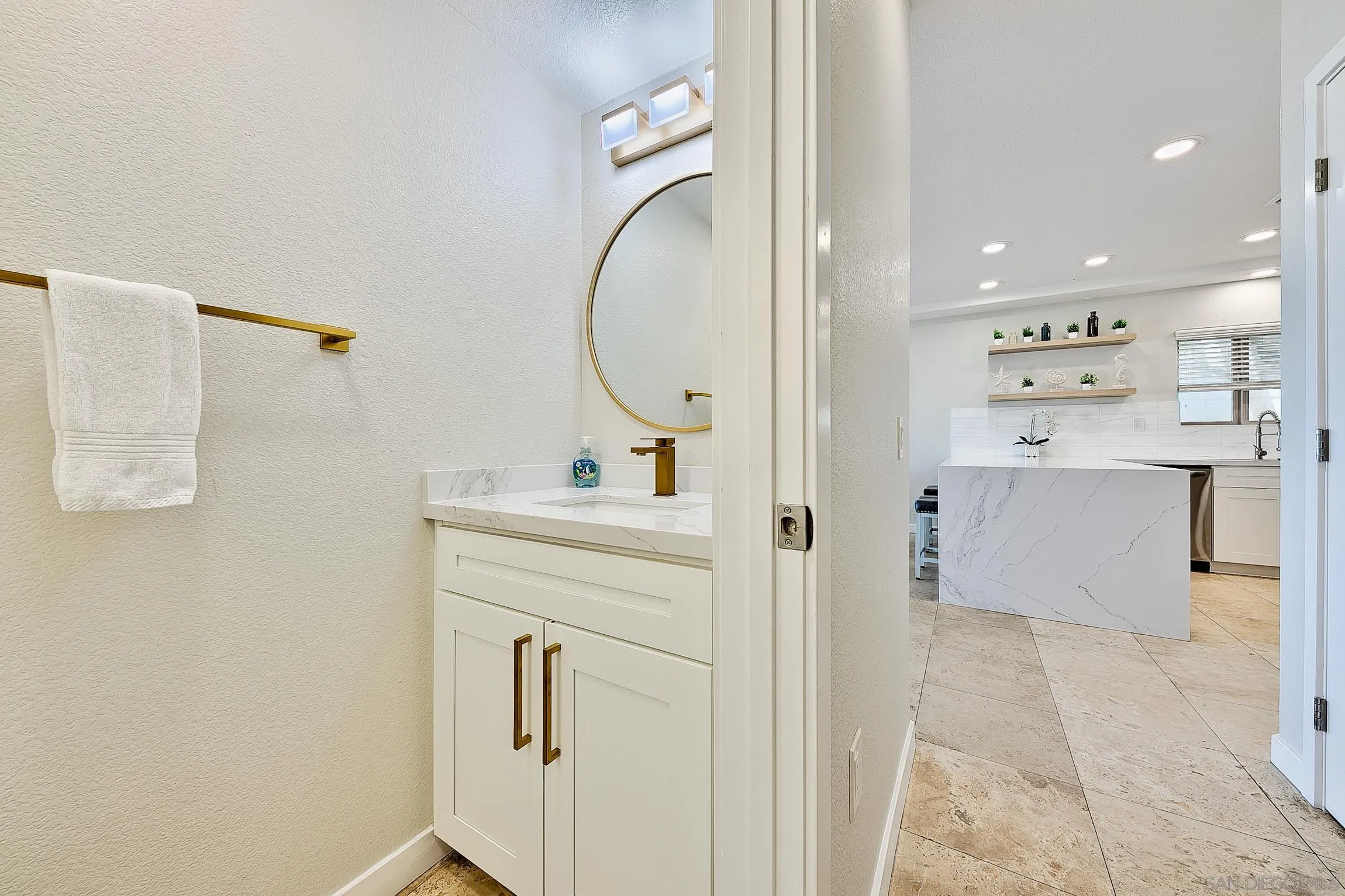 3537 Ocean Front Walk San Diego, CA 92109 - Photo 26 of 51 a bathroom with a sink vanity and a mirror