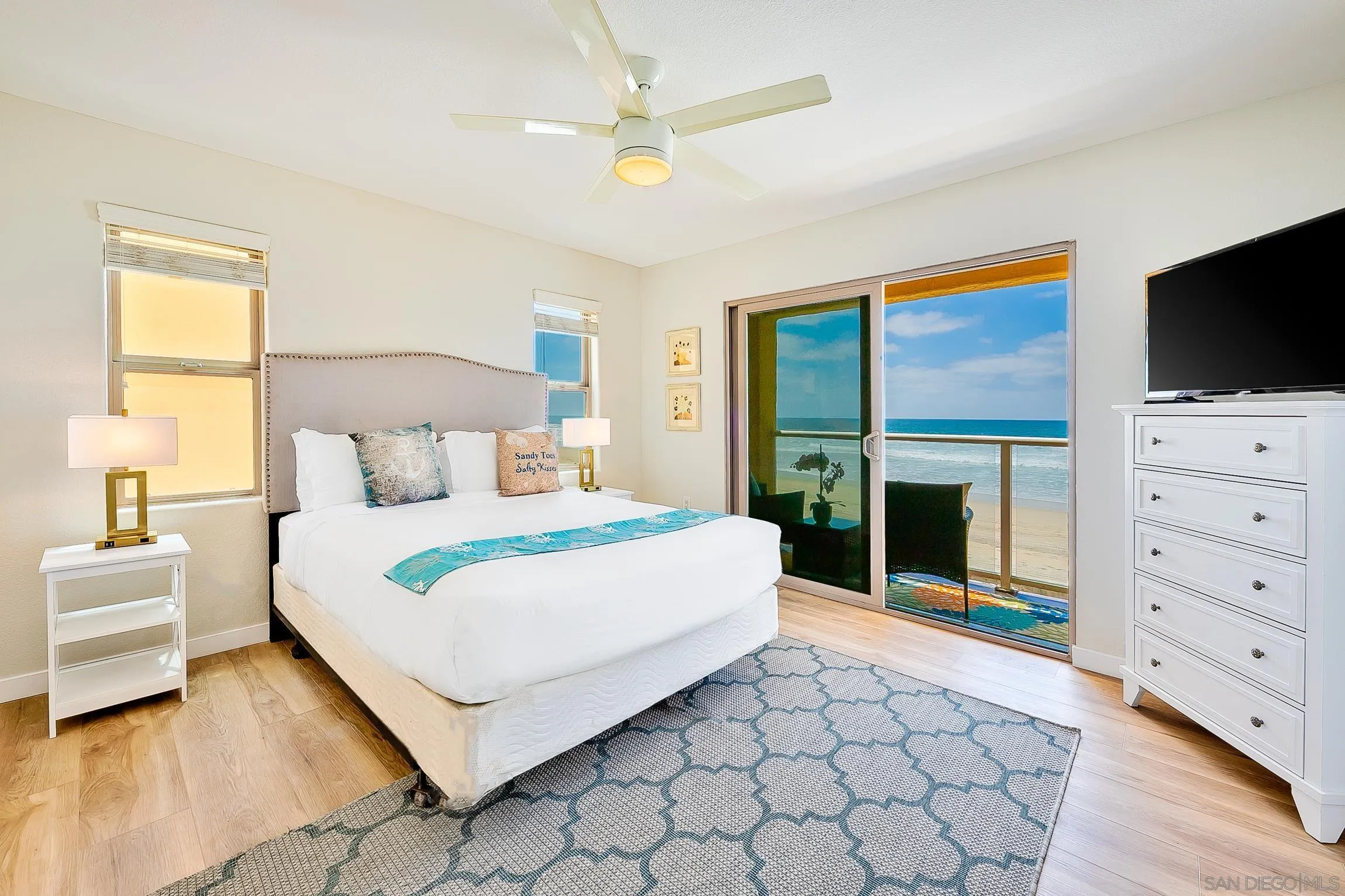 3537 Ocean Front Walk San Diego, CA 92109 - Photo 28 of 51 a bedroom with a bed and a flat screen tv