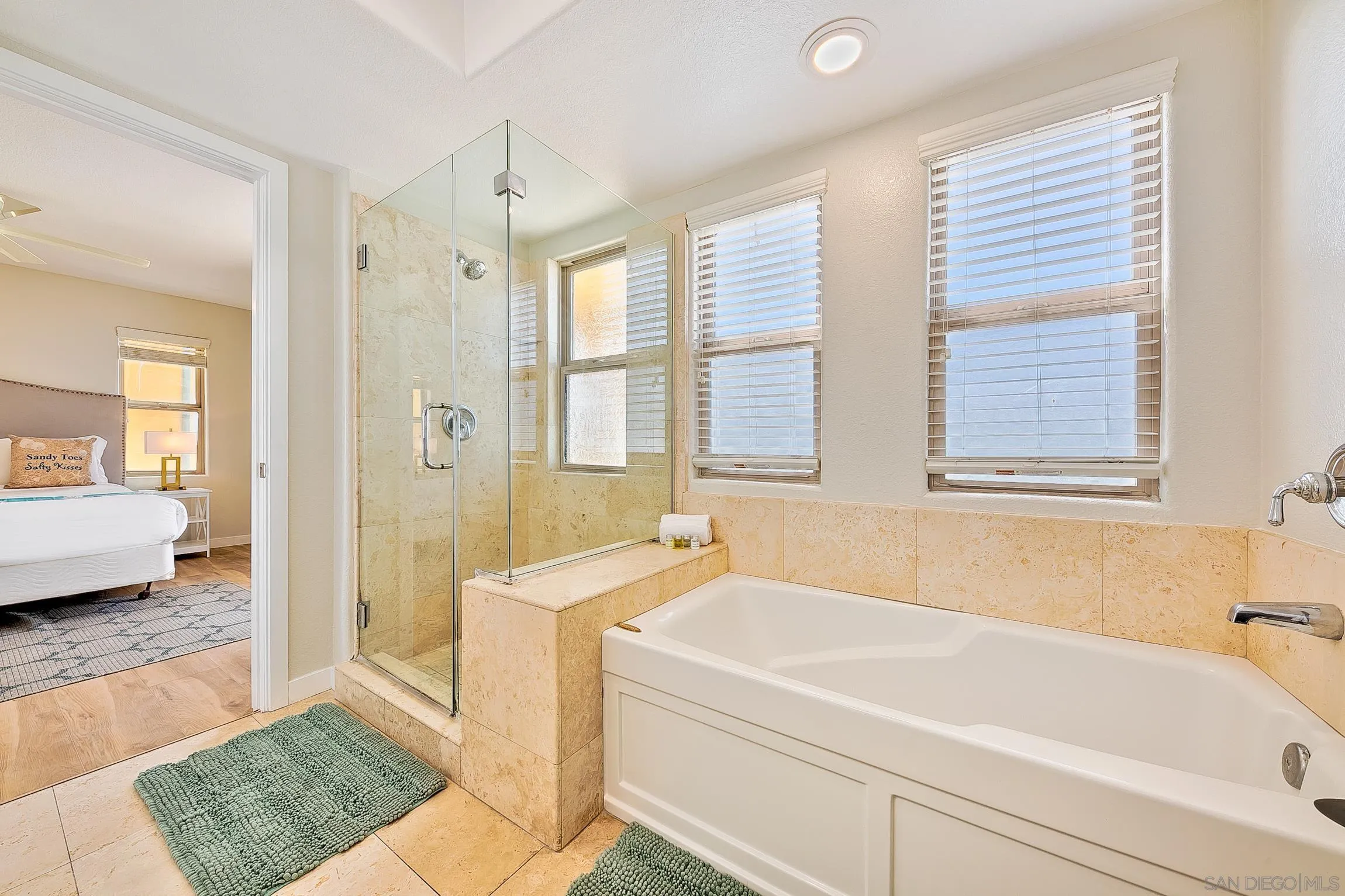 3537 Ocean Front Walk San Diego, CA 92109 - Photo 38 of 51 a bathroom with a tub a sink and a window