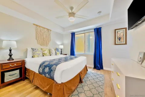 a bedroom with a bed and a lamp