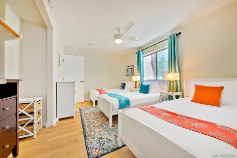 a bedroom with a bed and a dresser