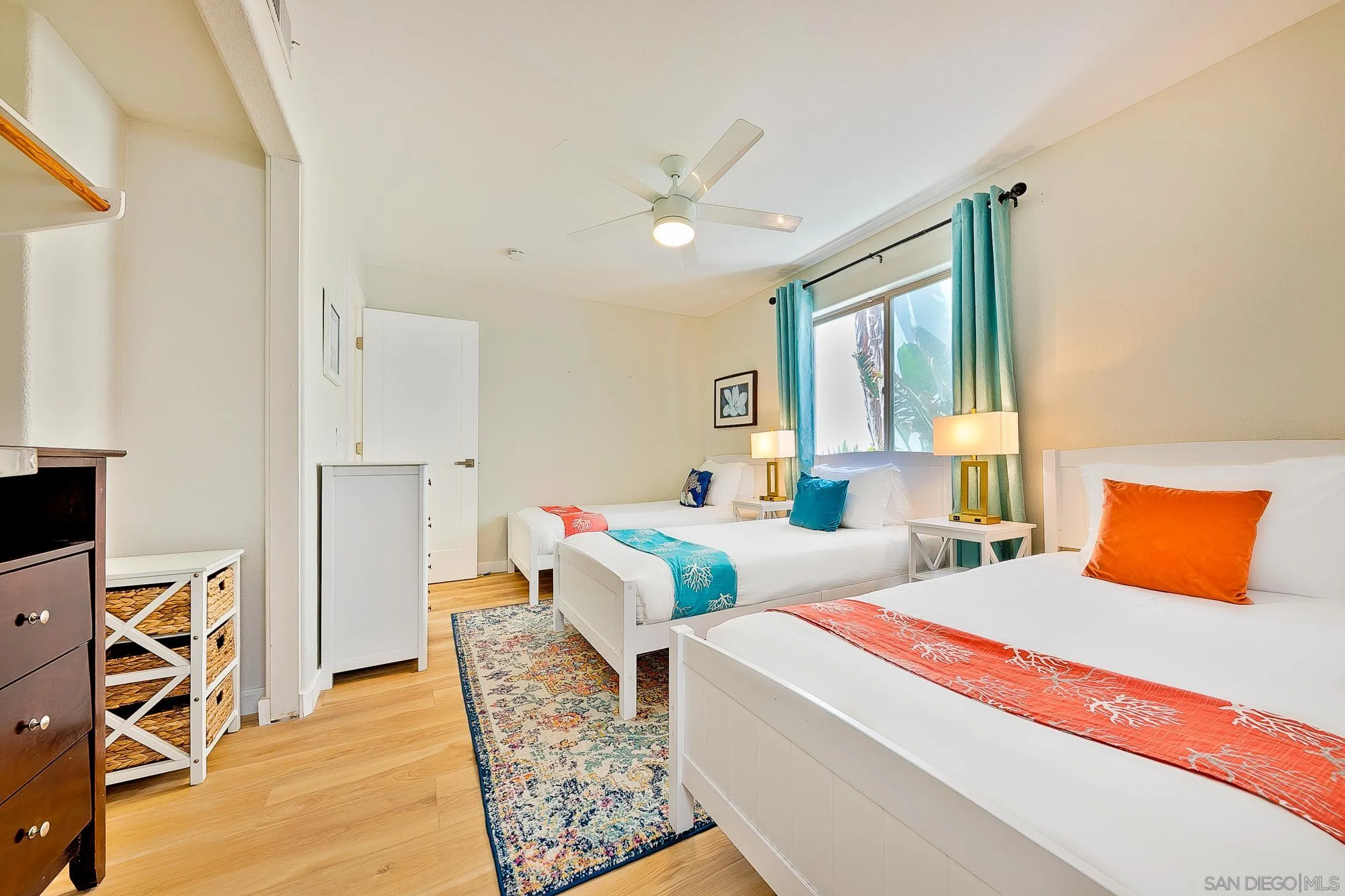 3537 Ocean Front Walk San Diego, CA 92109 - Photo 44 of 51 a bedroom with two beds and a dresser