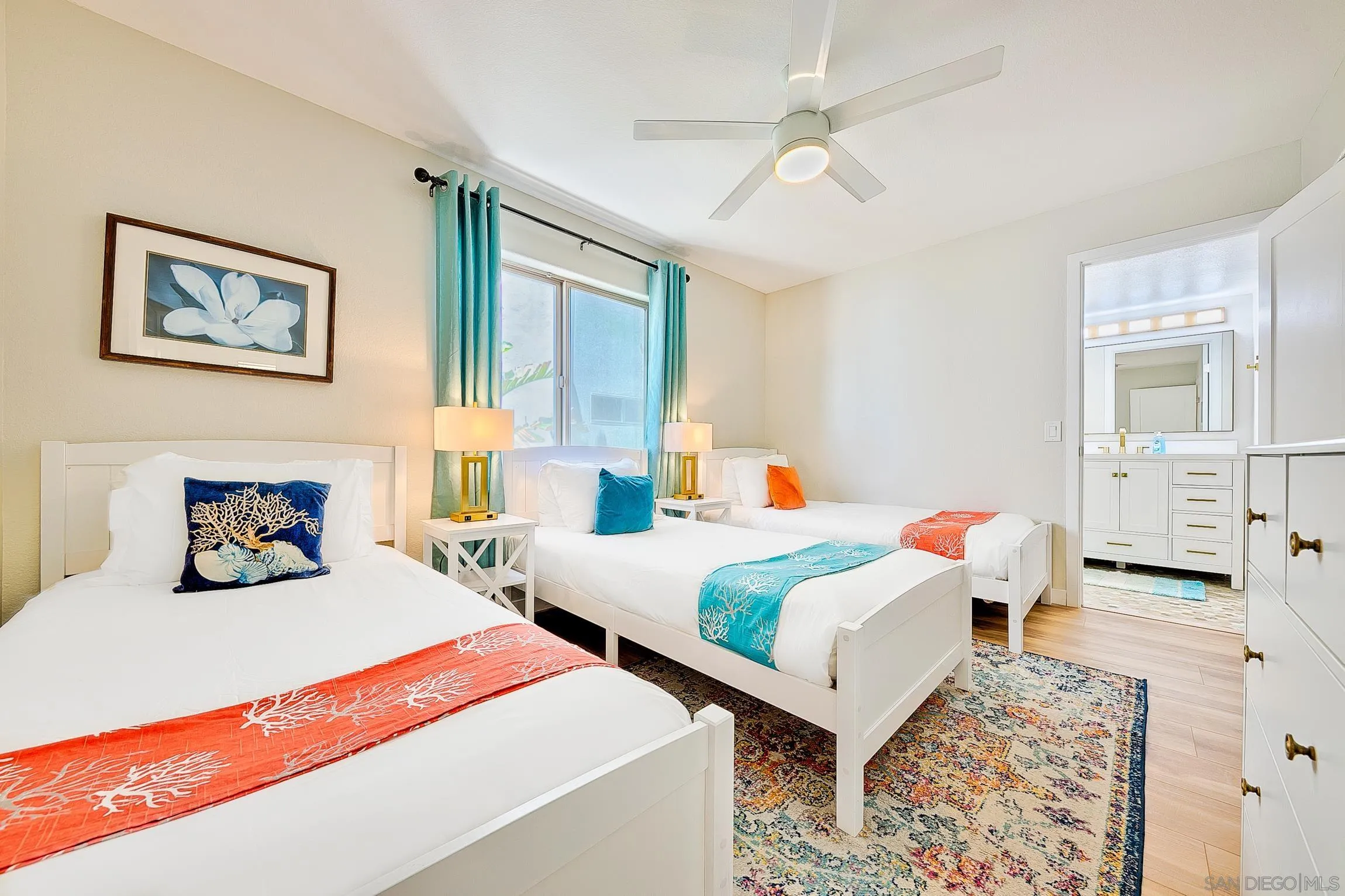 3537 Ocean Front Walk San Diego, CA 92109 - Photo 45 of 51 a bedroom with two beds and painting on the wall