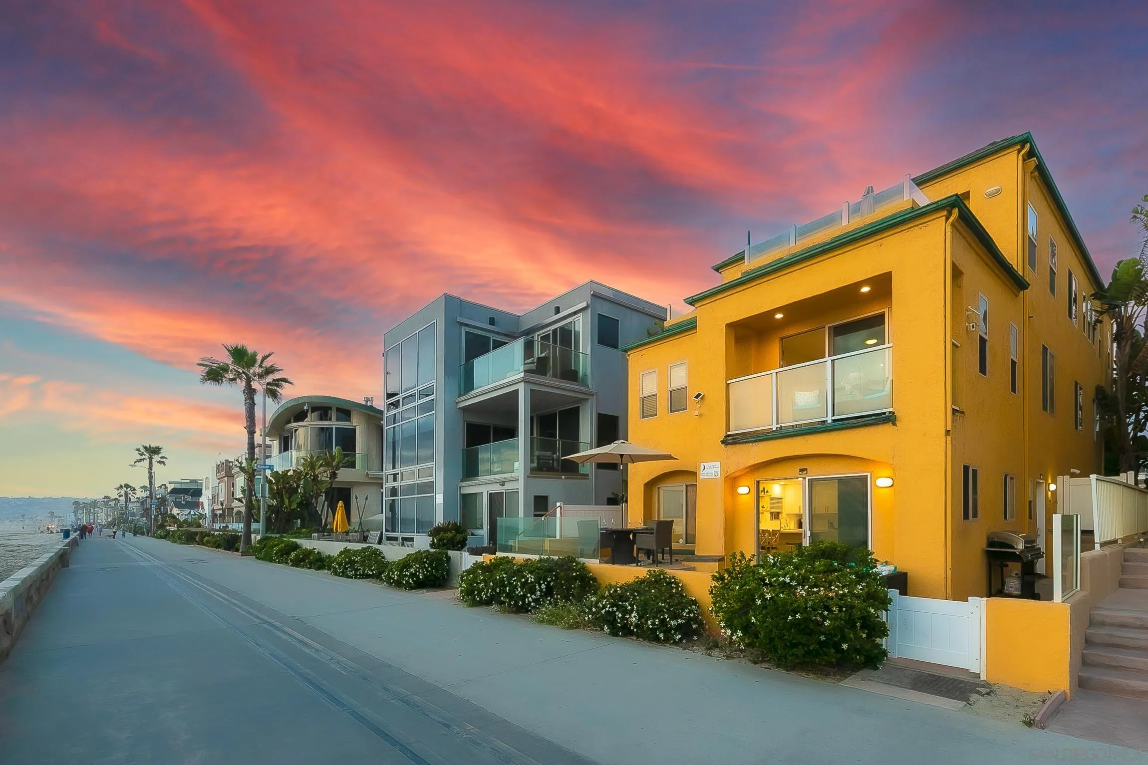 3537 Ocean Front Walk San Diego, CA 92109 - Photo 49 of 51 a front view of a multi story residential apartment building with garage and parking space
