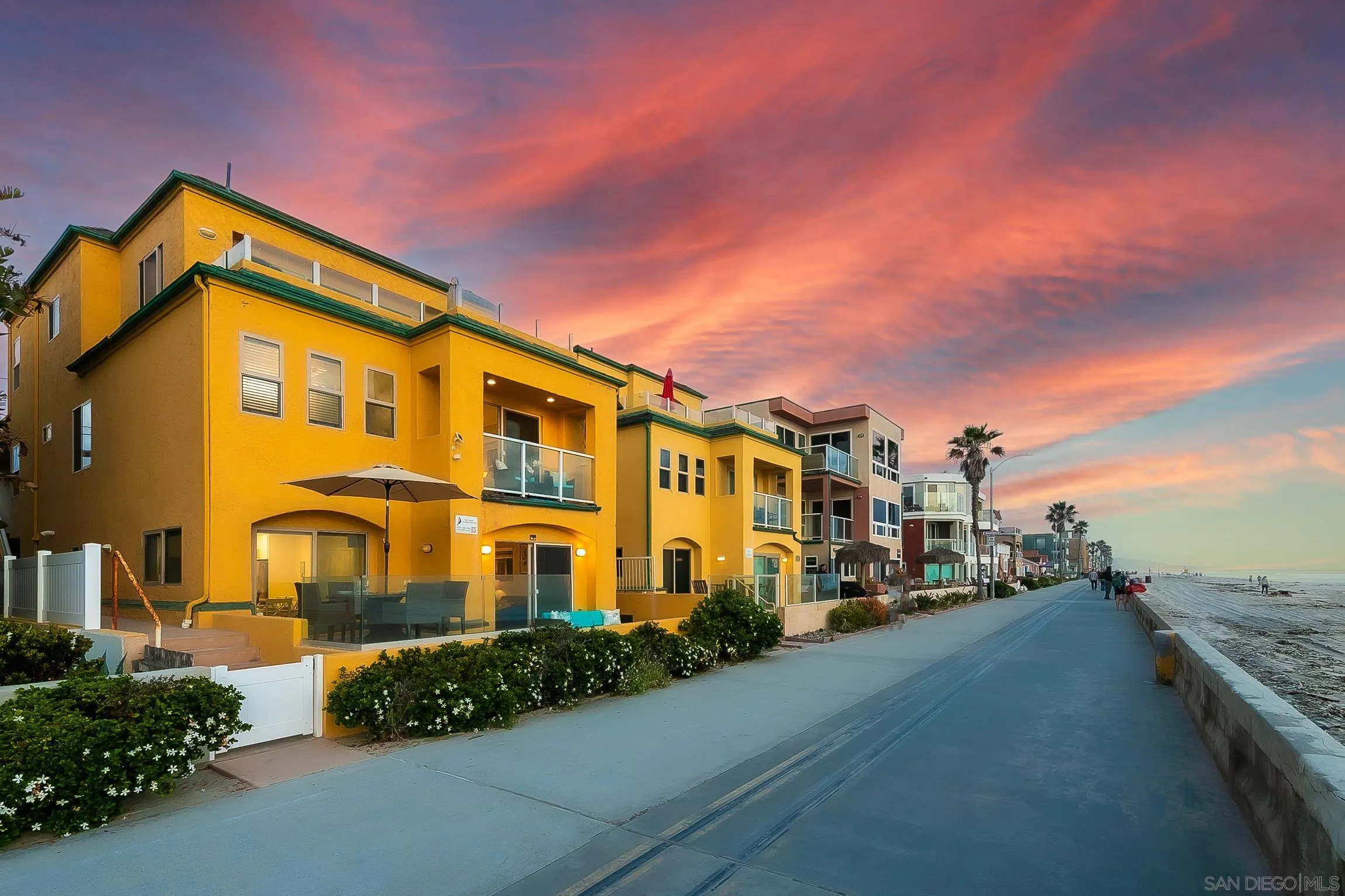 3537 Ocean Front Walk San Diego, CA 92109 - Photo 5 of 51 a front view of a house with a yard
