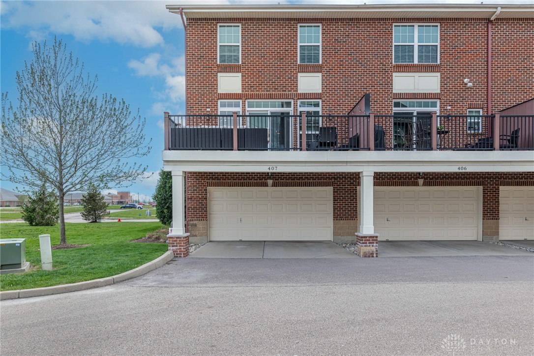 407 Brownstone Row Springboro, OH 45066 - Photo 48 of 54 This brick townhome offers private balconies and individual garages, combining comfort with convenience.