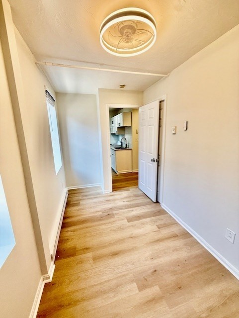 7 Tileston Street, Unit 2 Boston, MA 02113 - Photo 8 of 12 a view of empty room with wooden floor