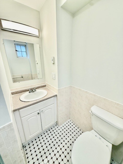 7 Tileston Street, Unit 2 Boston, MA 02113 - Photo 10 of 12 a bathroom with a sink a toilet and a mirror