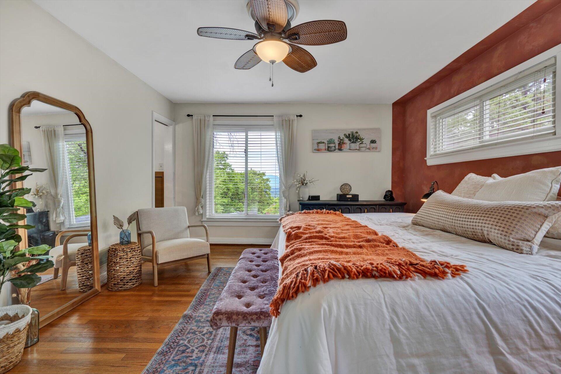 3038 Burnleigh Road Southwest Roanoke, VA 24014 - Photo 17 of 34 a bedroom with a large bed and a chandelier