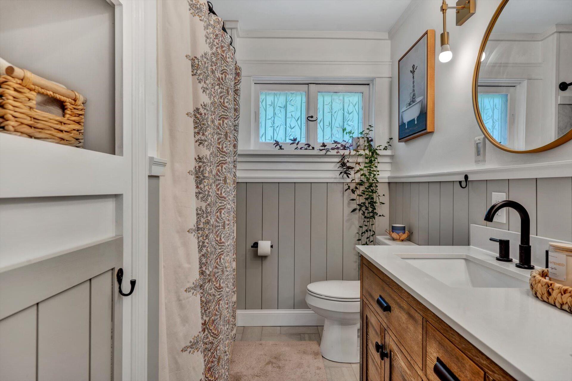 3038 Burnleigh Road Southwest Roanoke, VA 24014 - Photo 23 of 34 a bathroom with a sink a toilet and a mirror