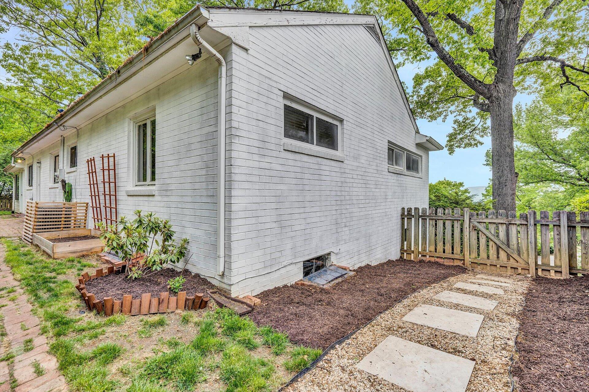 3038 Burnleigh Road Southwest Roanoke, VA 24014 - Photo 29 of 34 a front view of a house with a yard