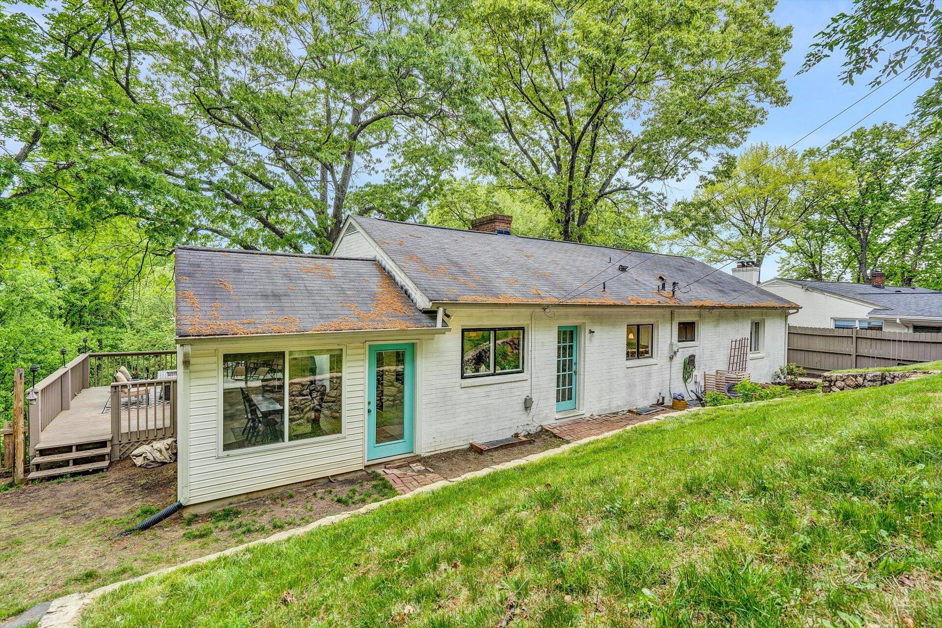 3038 Burnleigh Road Southwest Roanoke, VA 24014 - Photo 31 of 34 a view of a house with a yard and sitting area