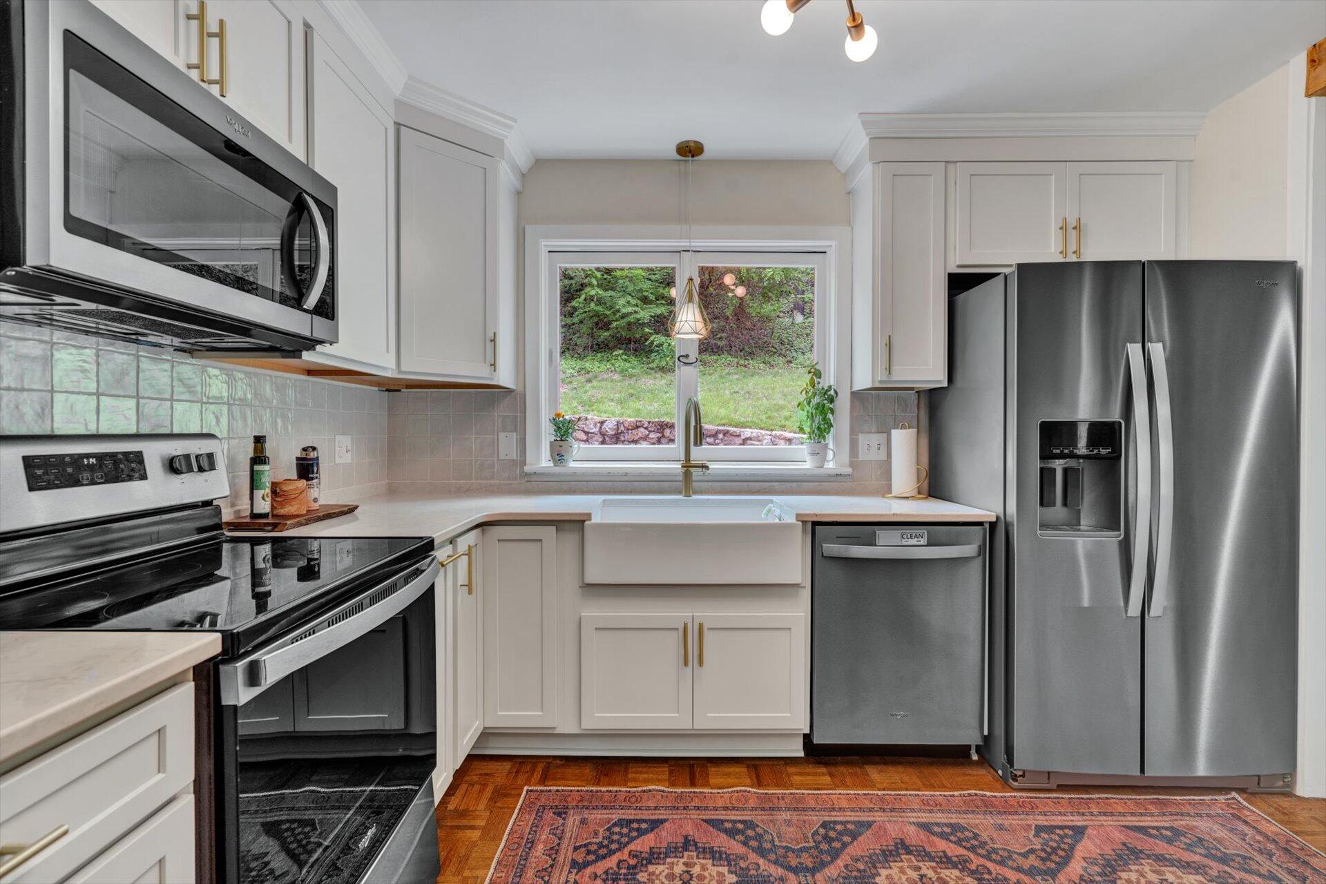 3038 Burnleigh Road Southwest Roanoke, VA 24014 - Photo 10 of 34 a kitchen with stainless steel appliances a stove sink and microwave