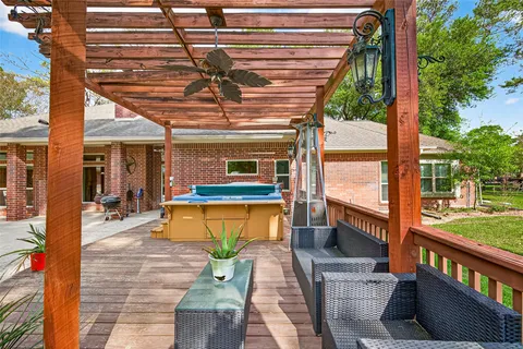 a view of a patio with a table and chairs