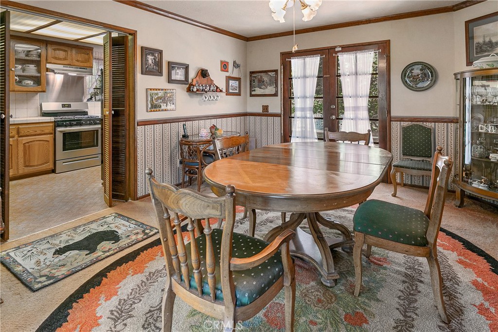 329 Grass Valley Road Lake Arrowhead, CA 92352 - Photo 13 of 31 a dining room with furniture and window