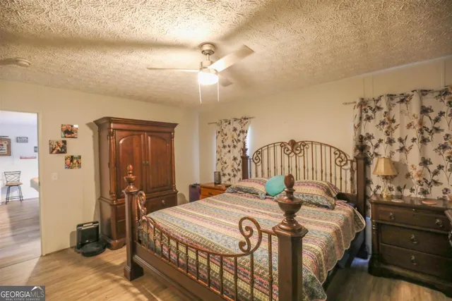 a view of a livingroom with furniture and a flat screen tv