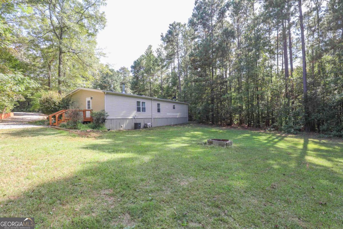 118 Napier Mill Road Southwest Eatonton, GA 31024 - Photo 2 of 33 a front view of a house with garden