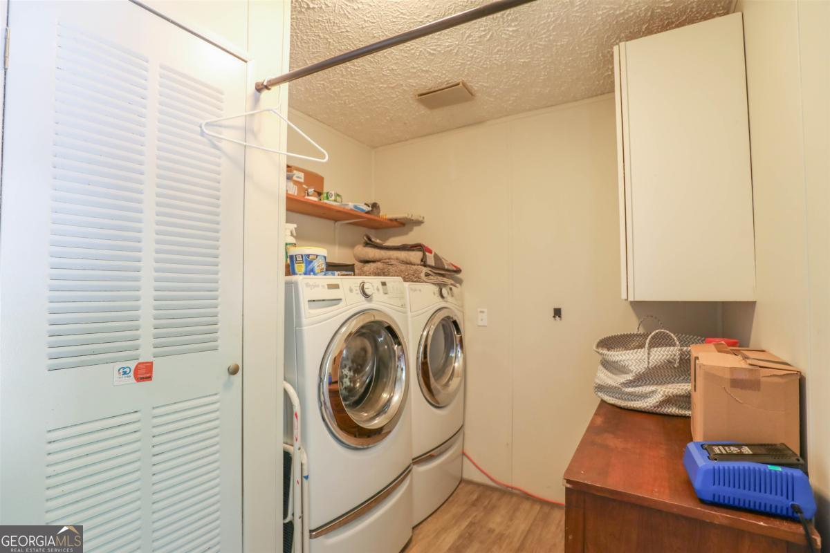 118 Napier Mill Road Southwest Eatonton, GA 31024 - Photo 23 of 33 a utility room with dryer and washer