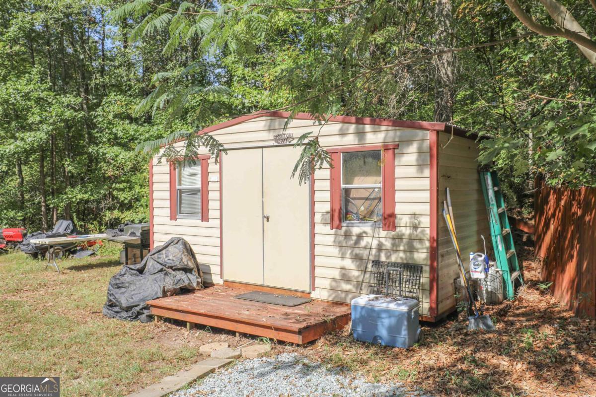 118 Napier Mill Road Southwest Eatonton, GA 31024 - Photo 29 of 33 a view of a house with backyard and sitting area