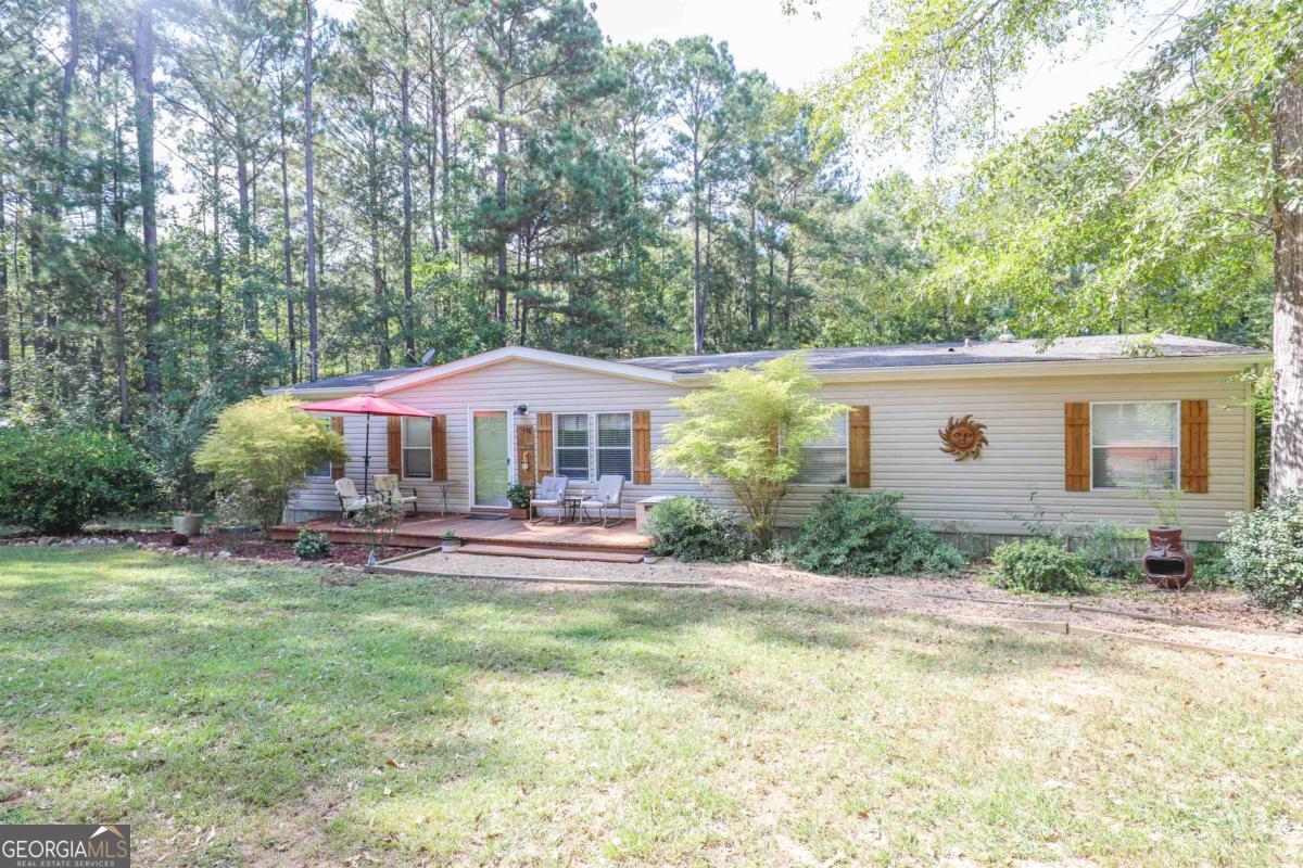 118 Napier Mill Road Southwest Eatonton, GA 31024 - Photo 31 of 33 a front view of a house with a yard