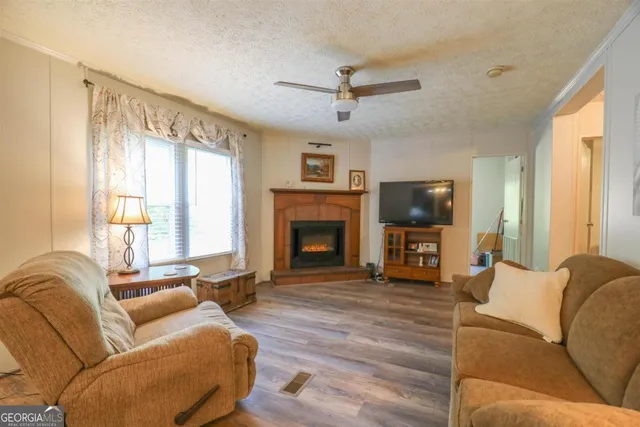 a kitchen with stainless steel appliances granite countertop a sink refrigerator and cabinets