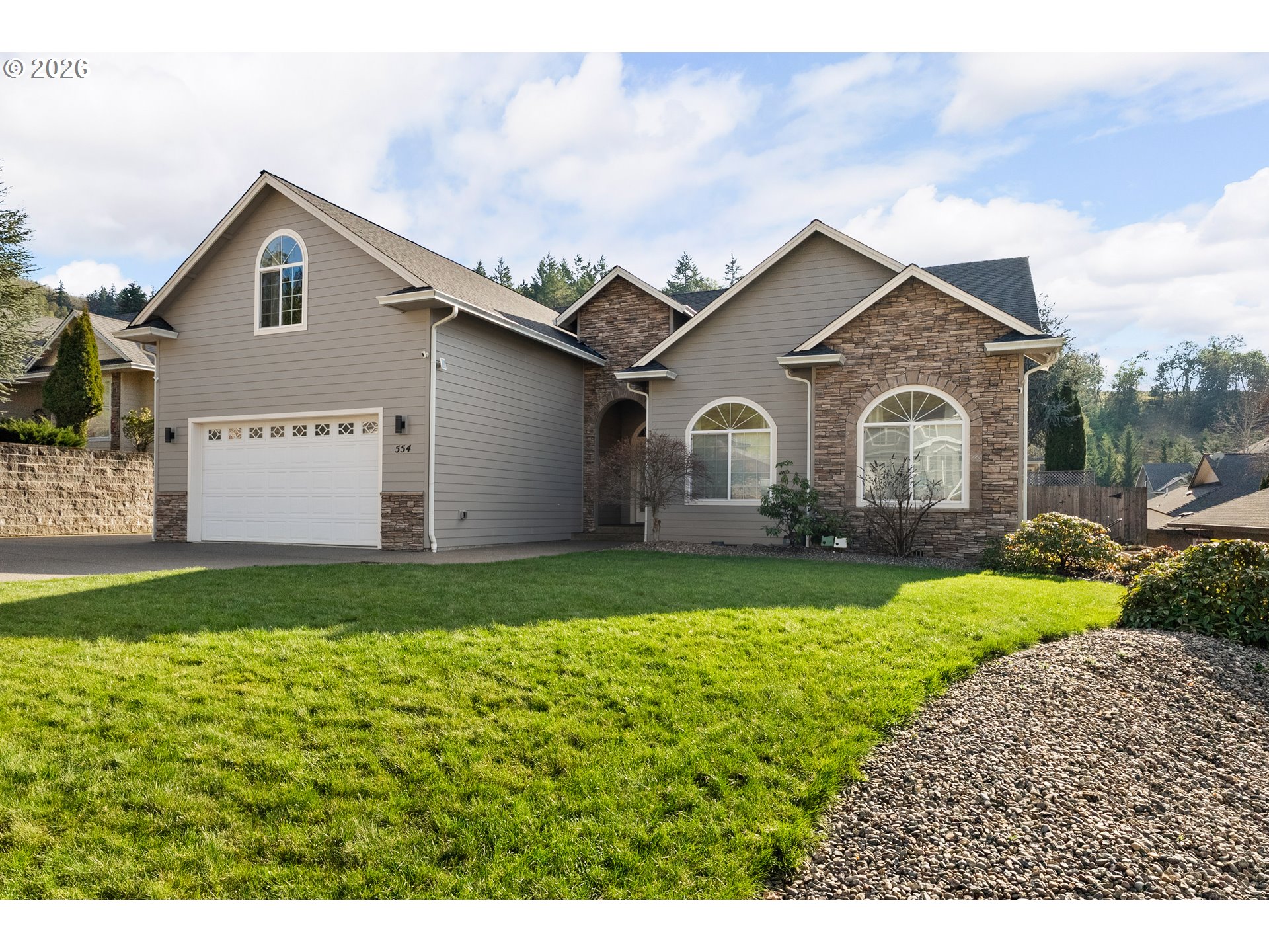 554 Oak Valley Loop Winchester, OR 97495 - Photo 1 of 42 a front view of house with yard and green space