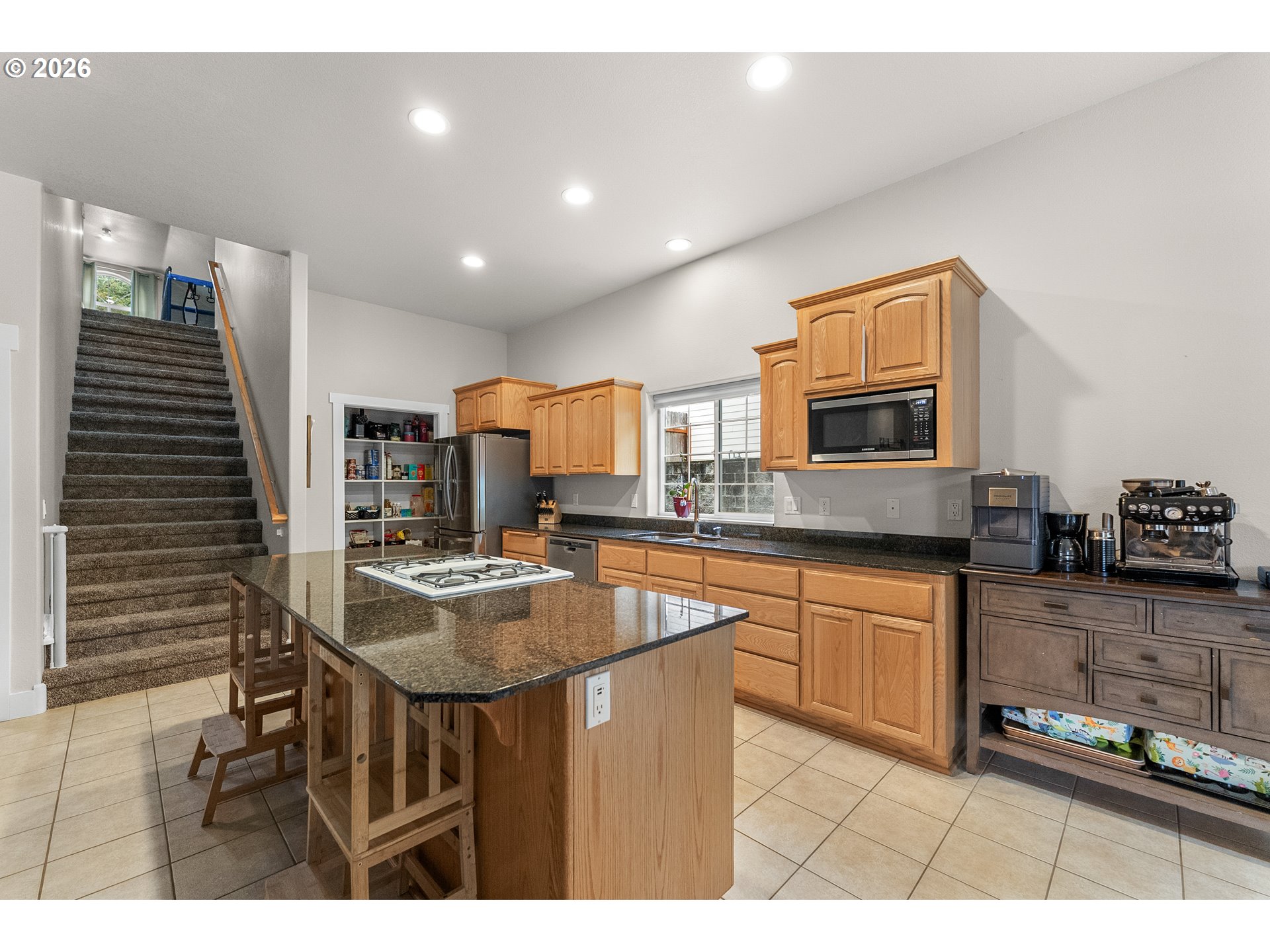 554 Oak Valley Loop Winchester, OR 97495 - Photo 11 of 42 a kitchen with stainless steel appliances granite countertop a sink and cabinets
