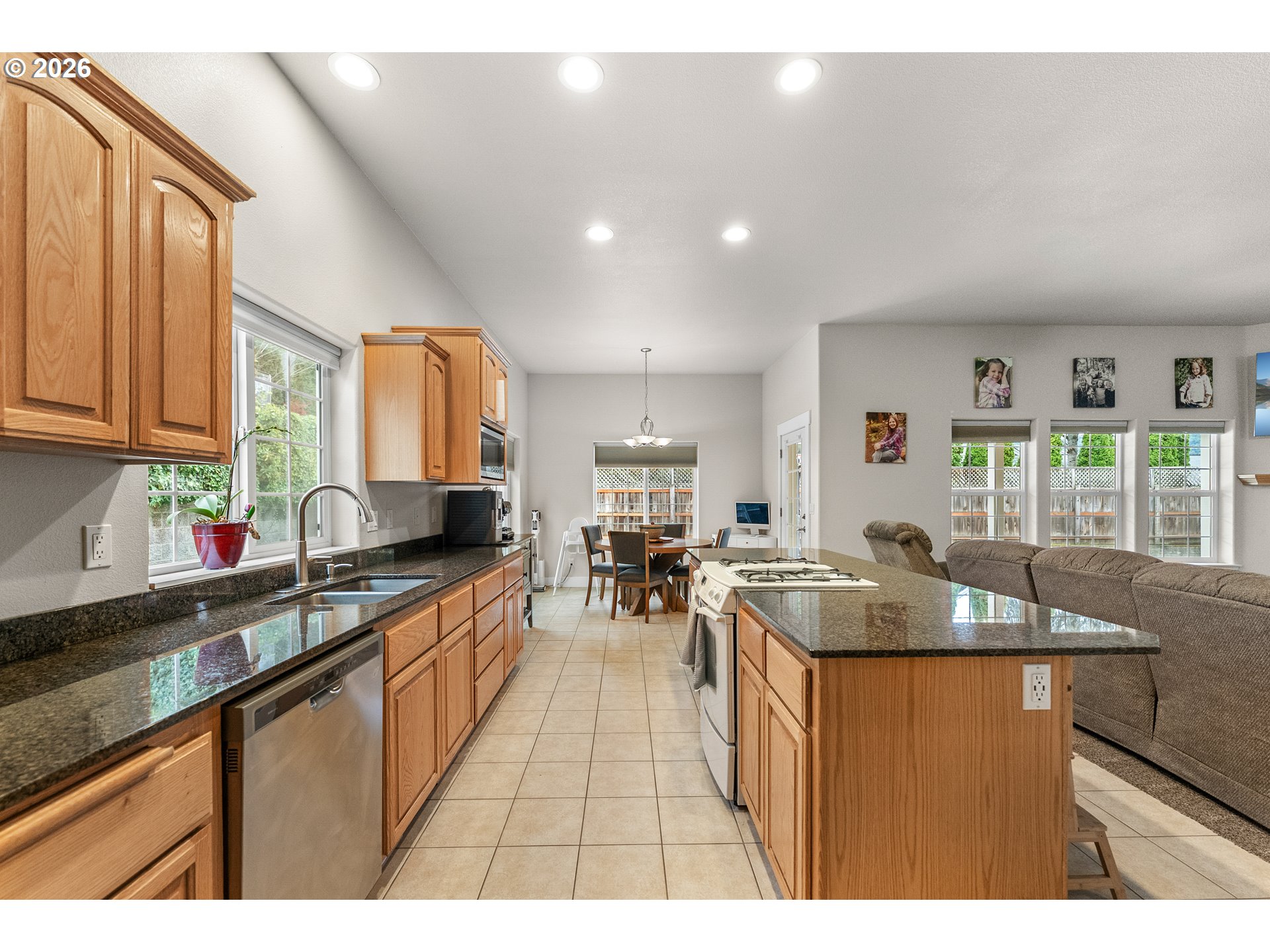 554 Oak Valley Loop Winchester, OR 97495 - Photo 13 of 42 a kitchen with counter top space a sink appliances and cabinets