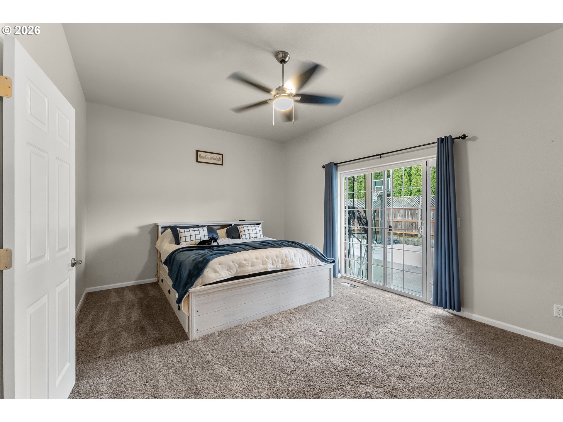 554 Oak Valley Loop Winchester, OR 97495 - Photo 18 of 42 a bedroom with a large bed and a ceiling fan