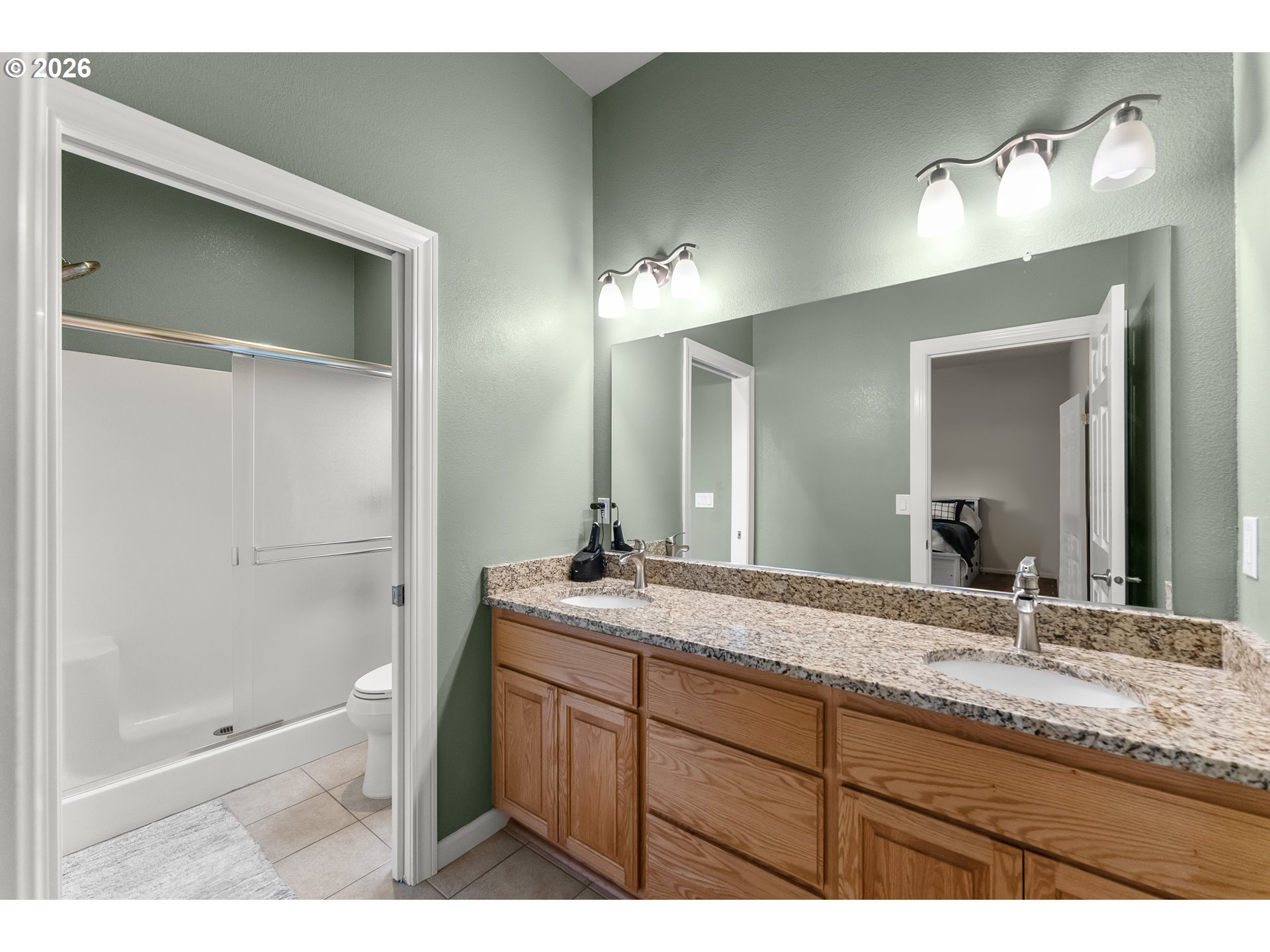 554 Oak Valley Loop Winchester, OR 97495 - Photo 20 of 42 a bathroom with a granite countertop sink mirror and double