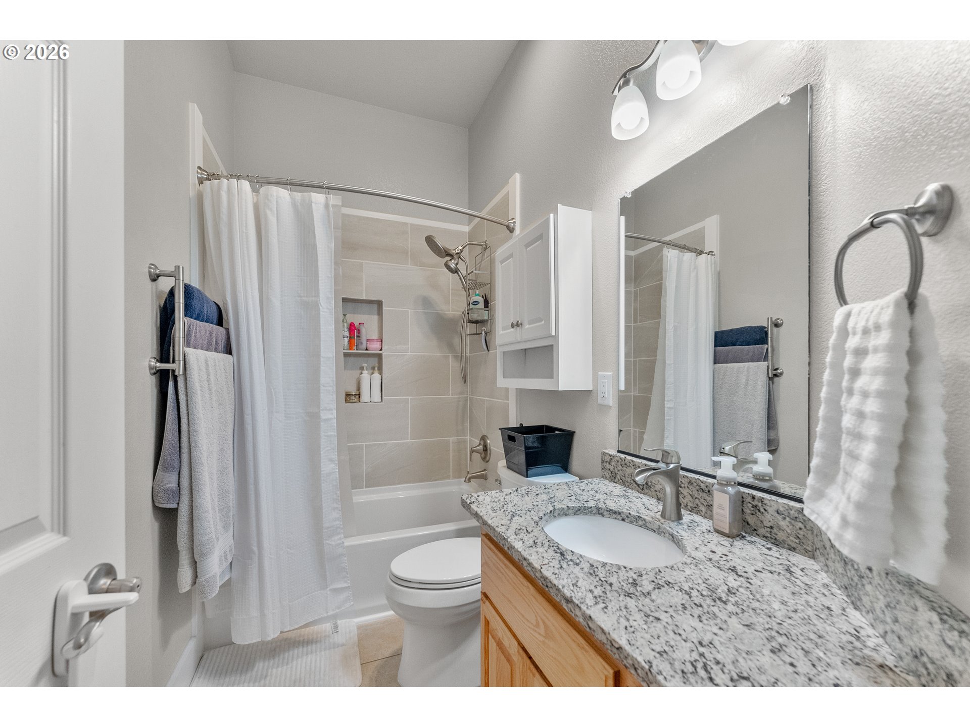 554 Oak Valley Loop Winchester, OR 97495 - Photo 27 of 42 a bathroom with a granite countertop sink toilet and shower